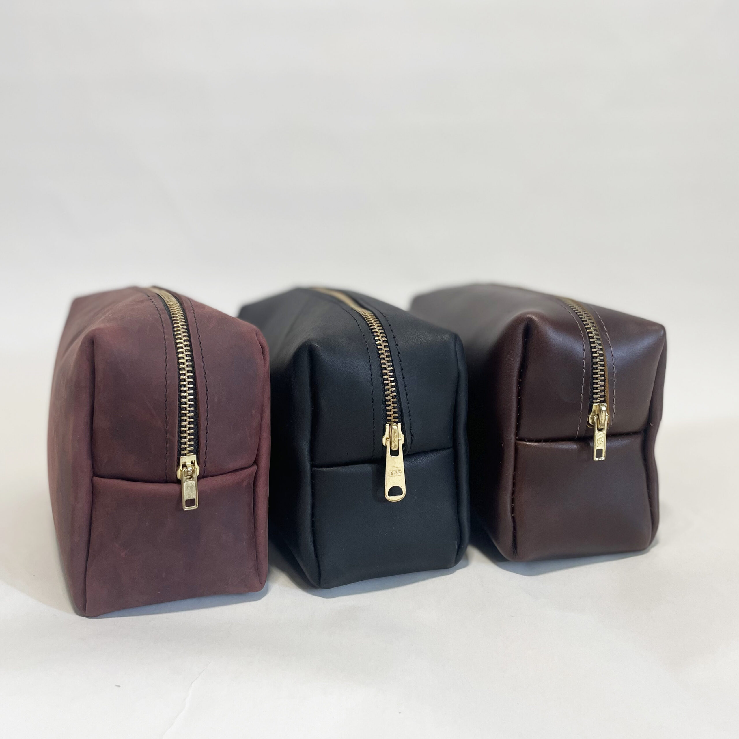three leather dopp kits